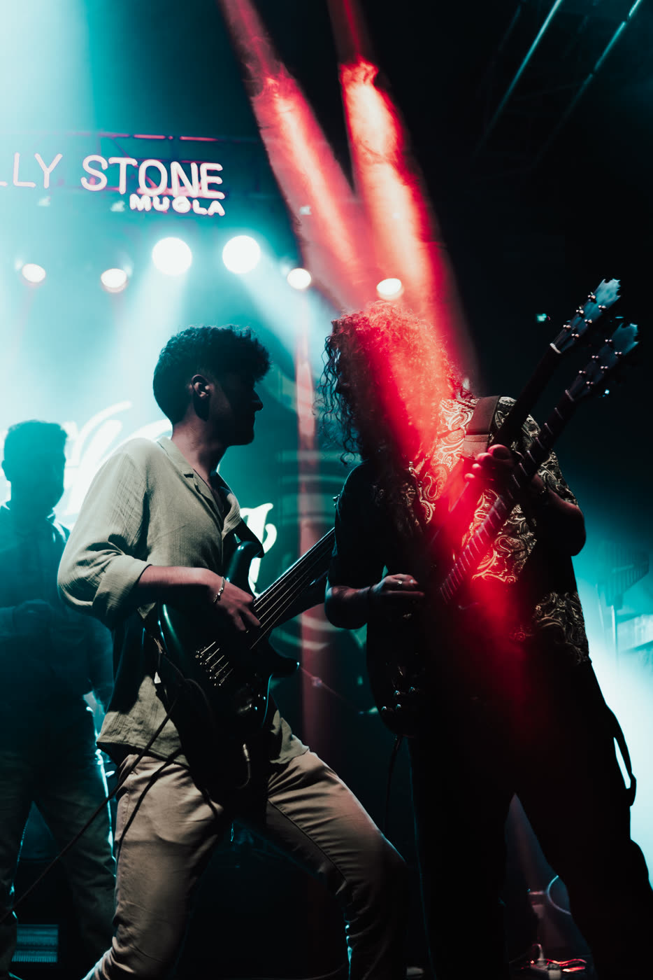 Bassist under red beams